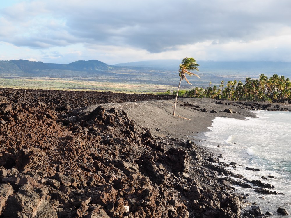 Secluded Beach By Rugged Terrain